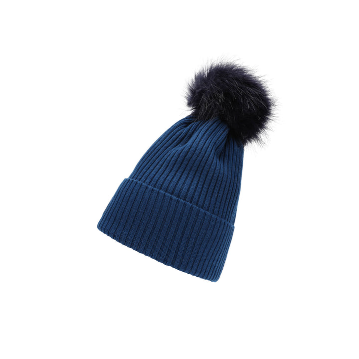 a blue hat with a black fur pom