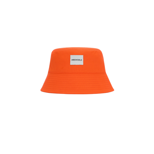 an orange bucket hat with a tag on it