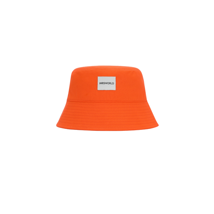 an orange bucket hat with a tag on it