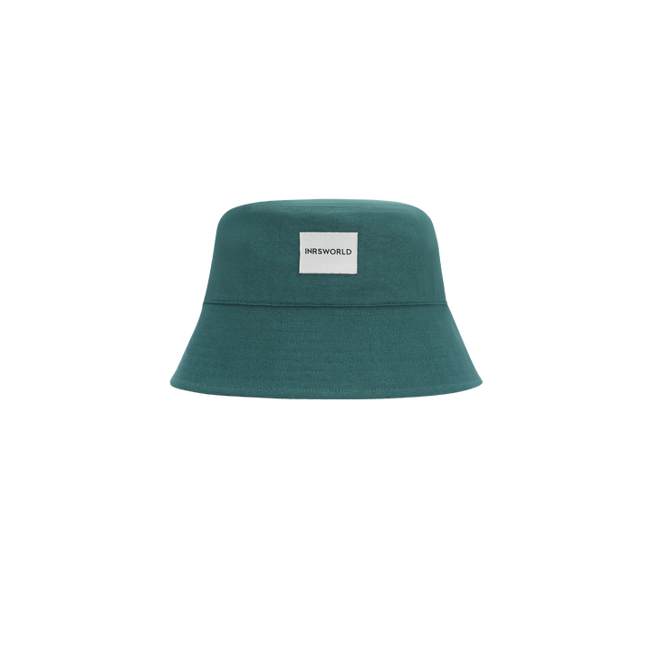 a teal hat with a white tag on it