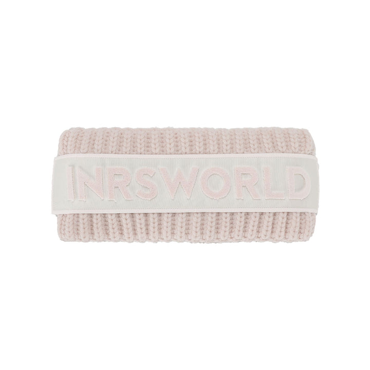 a pink knitted headband with the words inrsworld on it