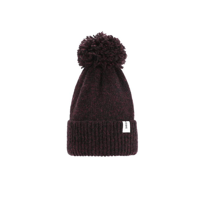 a beanie hat with a pom - pom